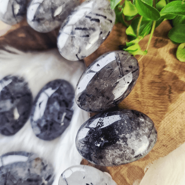 Tourmaline in quartz palm