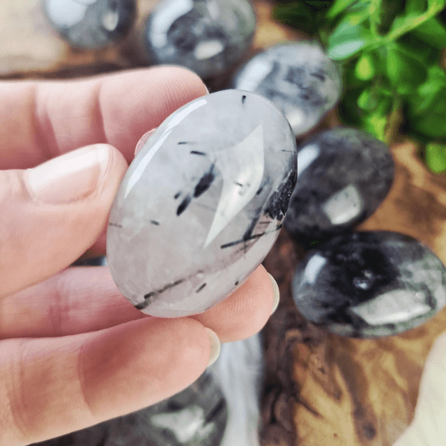Tourmaline in quartz palm