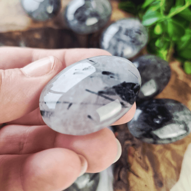 Tourmaline in quartz palm